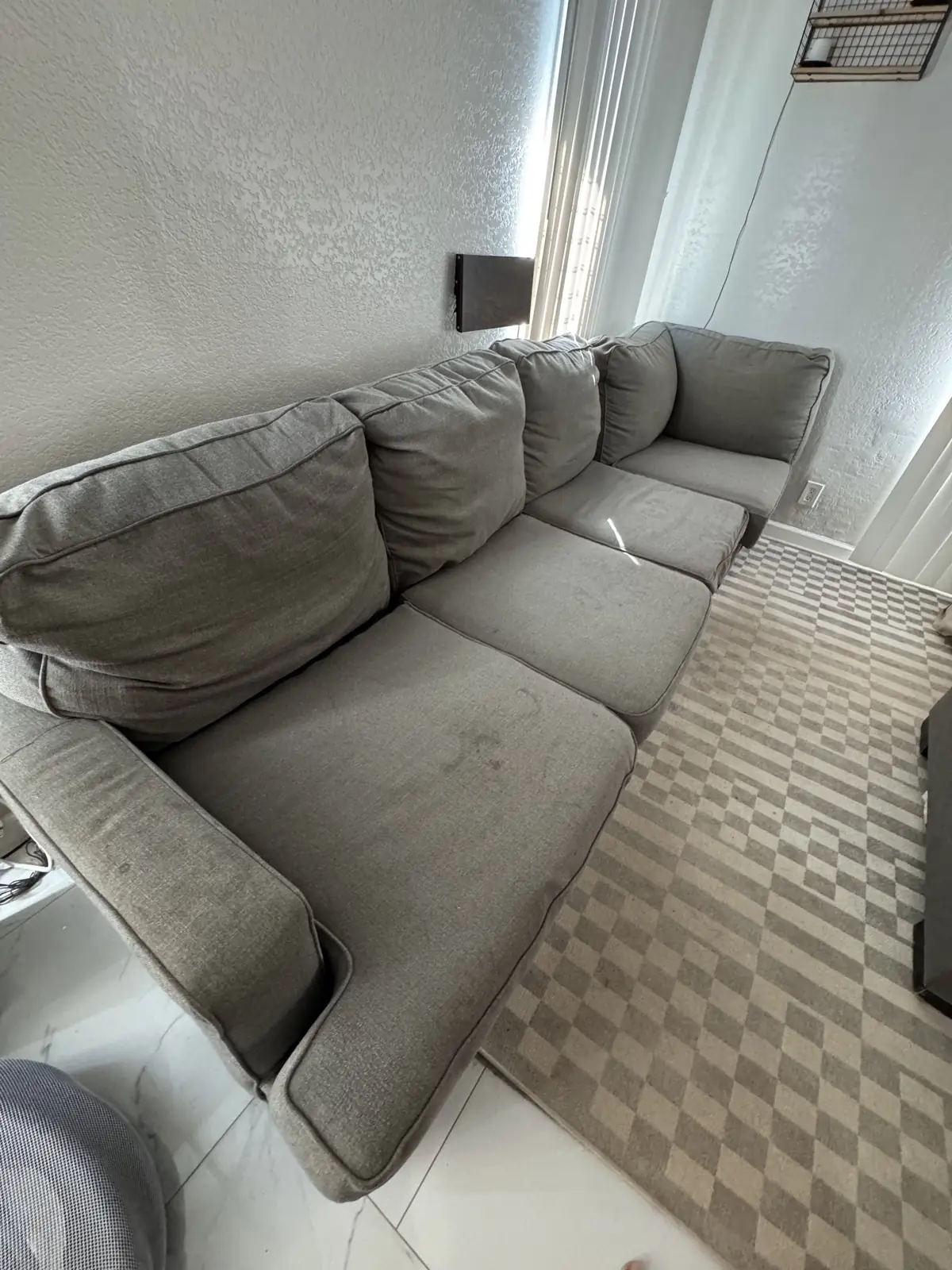 Gray sectional with water rings — before cleaning