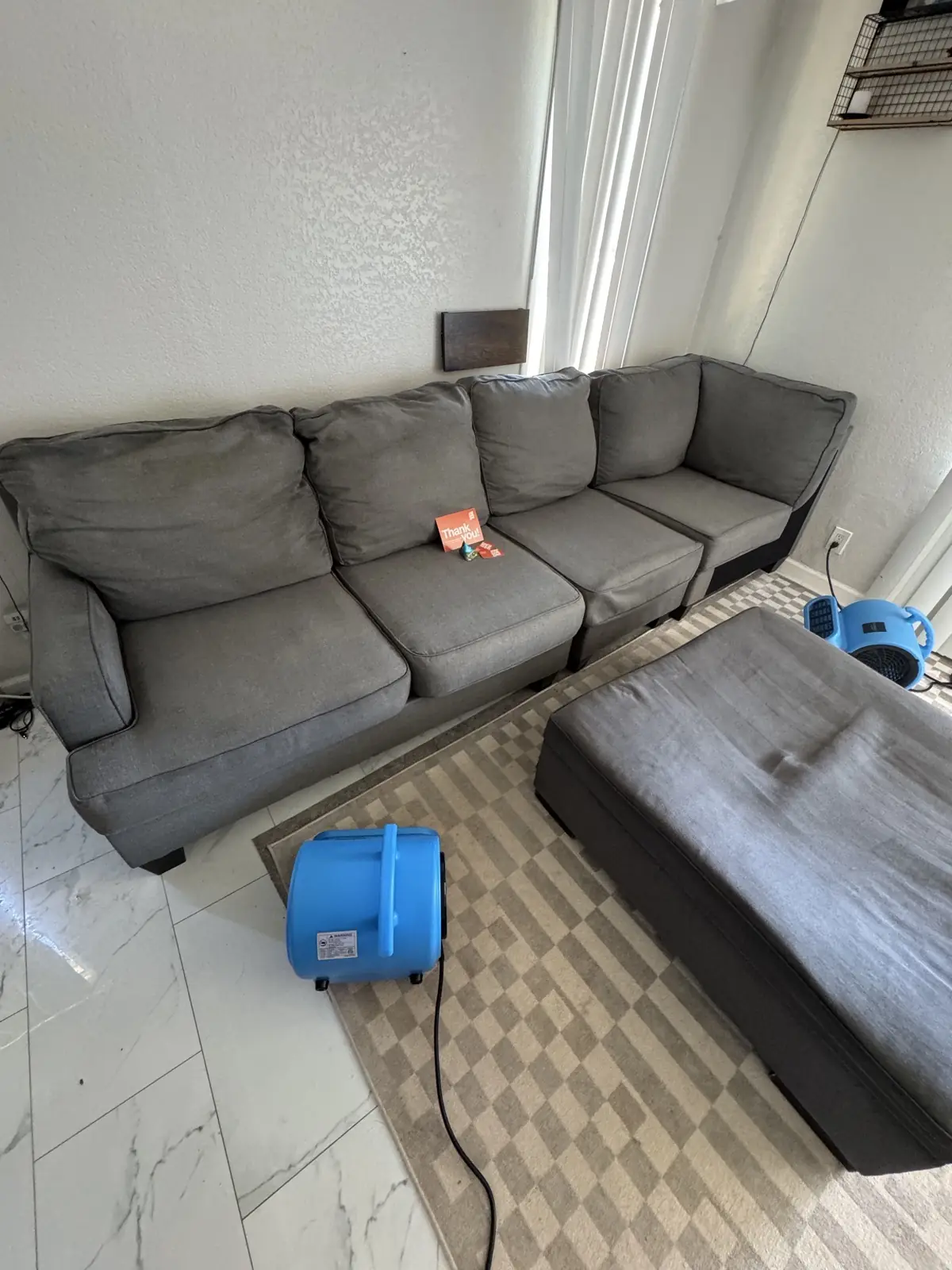 Gray sectional with water rings — after cleaning