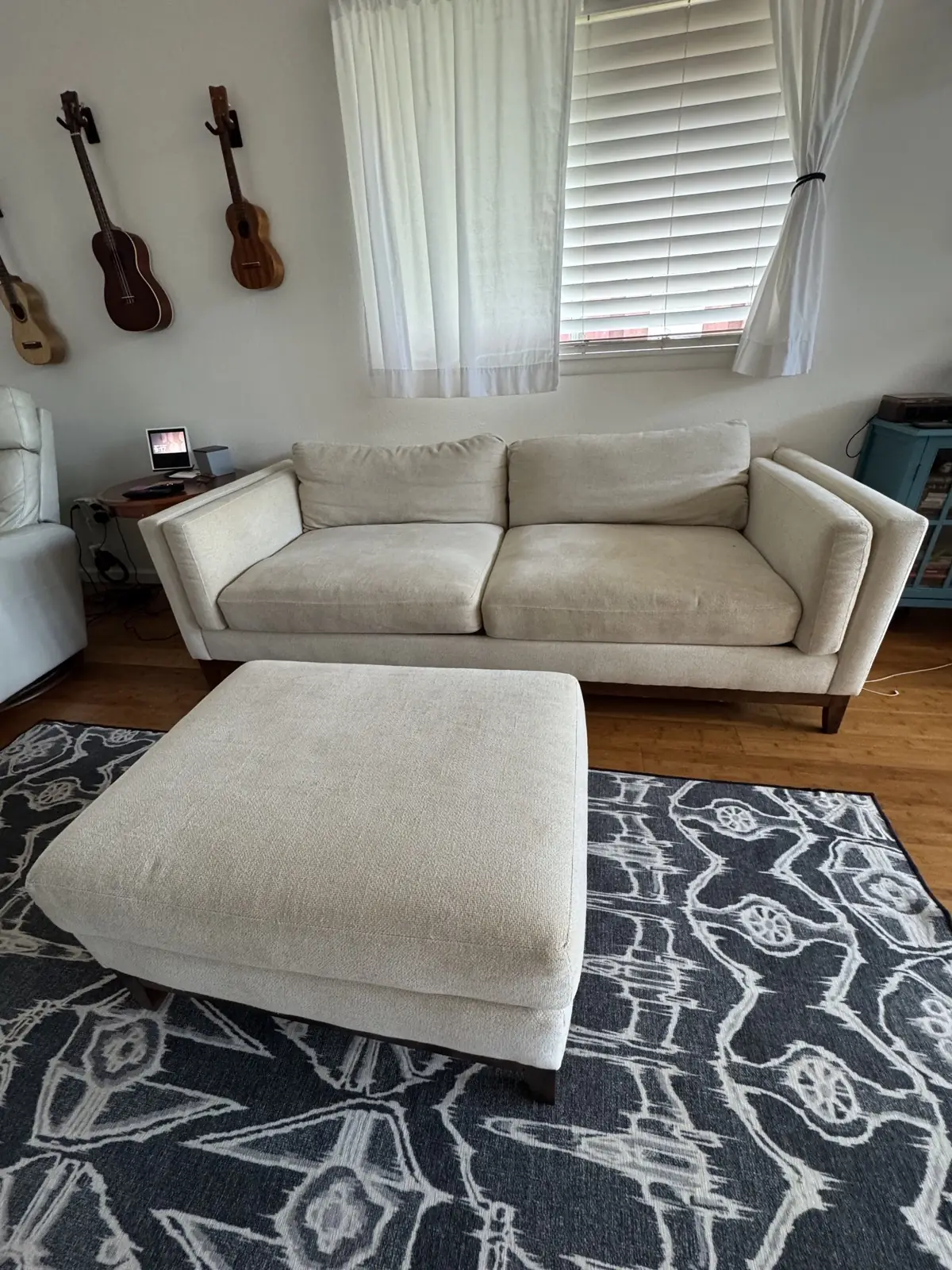 Cream sofa and ottoman — before cleaning